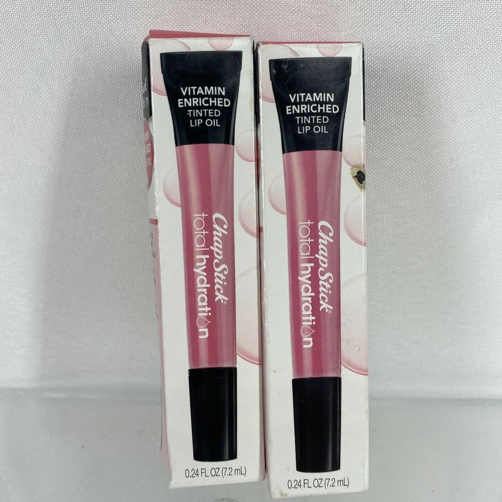 (2) Warm pink￼ Chapstick Total Hydration Vitamin Tinted Lip Oil￼ .24oz