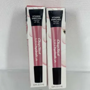 (2) Warm pink￼ Chapstick Total Hydration Vitamin Tinted Lip Oil￼ .24oz