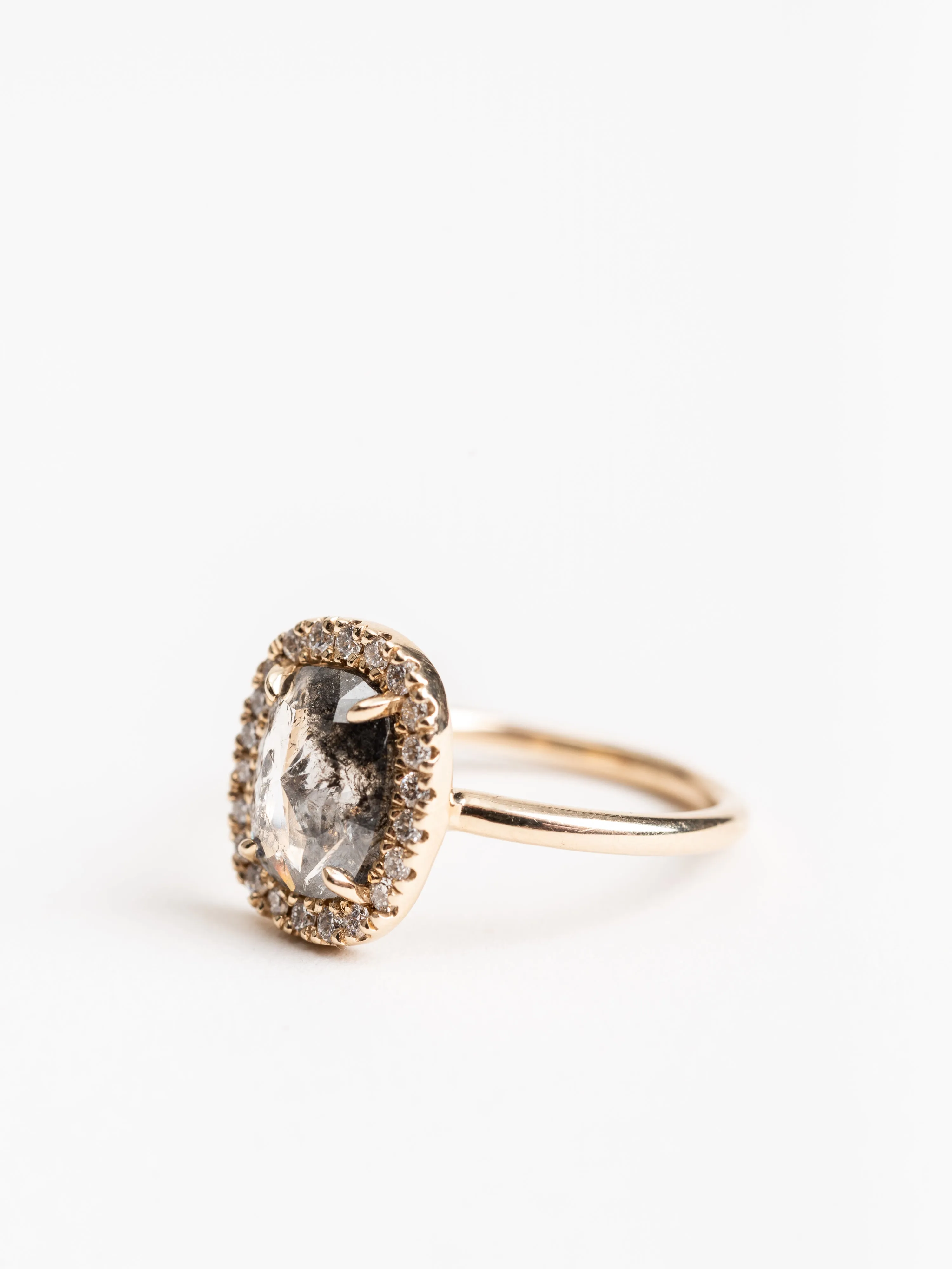 black oval diamond ring with halo setting