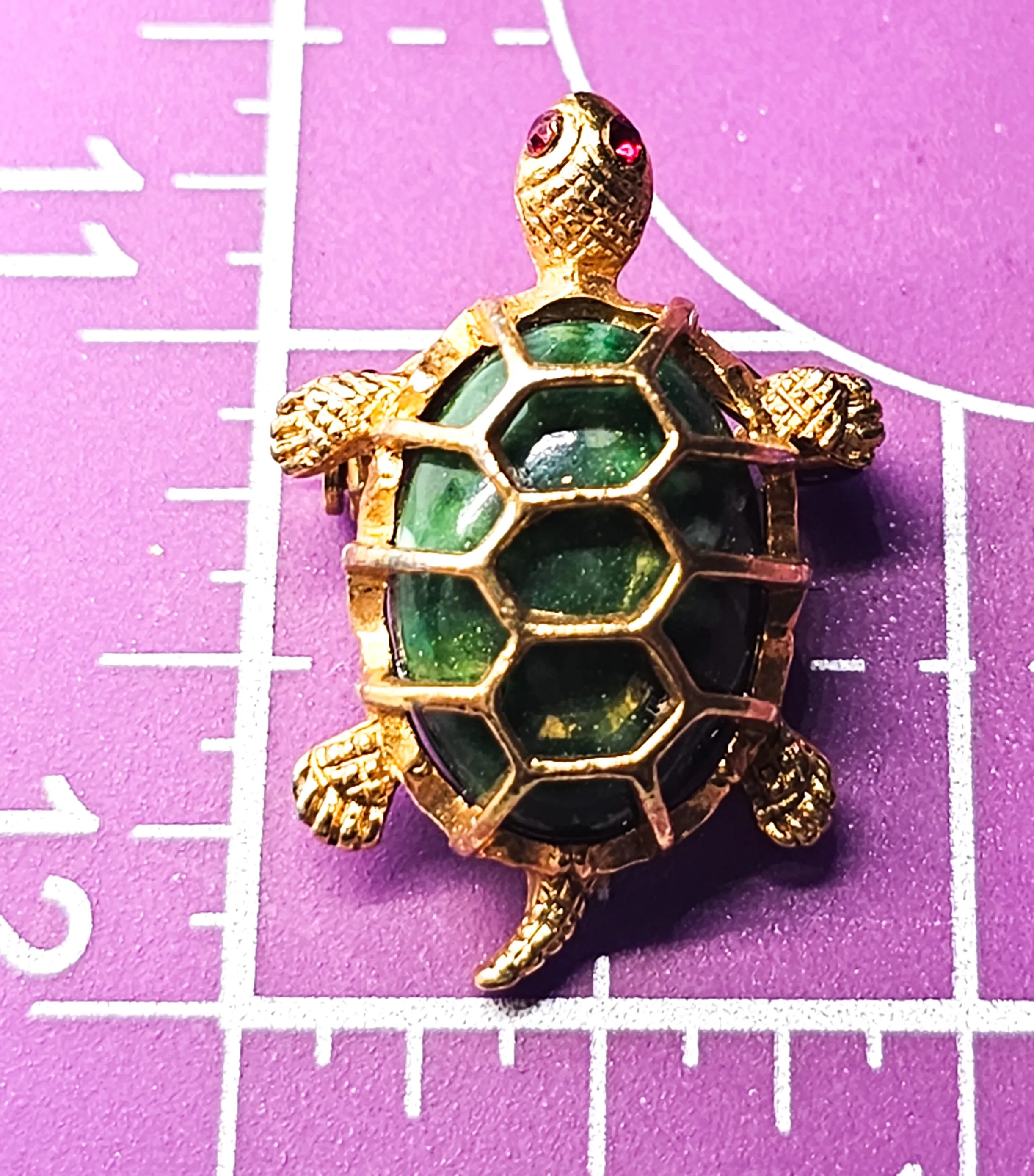 Turtle green lucite and gold toned vintage reptile brooch with red rhinestone eyes